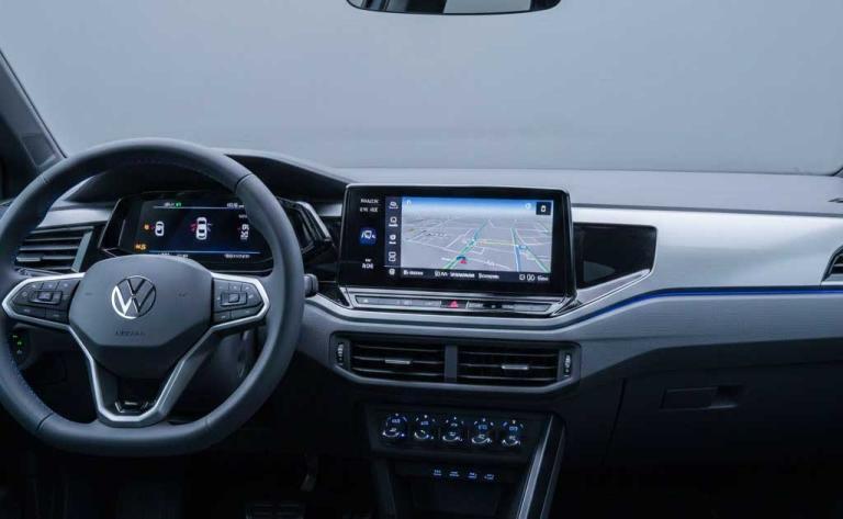 Interior of the 2026 Volkswagen ID. Polo showcasing physical buttons, rotary knobs, and a driver-focused EV cockpit design