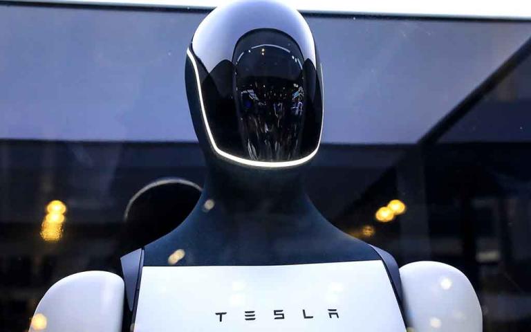 Tesla Optimus Gen 3 humanoid robot performing factory tasks with advanced hand dexterity and AI-powered vision system in 2026.