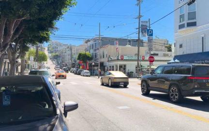 Tesla Cybercab robotaxi prototype testing on San Francisco streets with autonomous driving validation setup