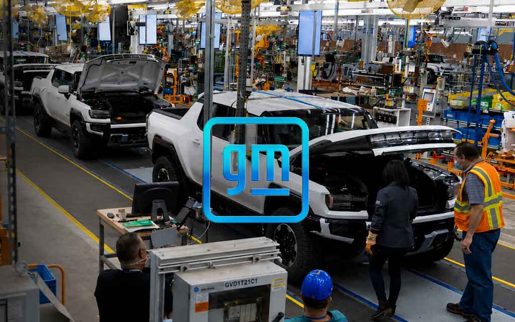 Collaborative robots working on an electric vehicle assembly line at GM Factory Zero while automated manufacturing expands.