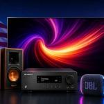 Collection of modern consumer electronics including OLED TV, gaming headset, bookshelf speakers, amplifier, and portable Bluetooth speaker