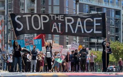 Protesters gathered outside OpenAI, Anthropic, and Google DeepMind offices in San Francisco holding anti-AI signs demanding a pause in AI development