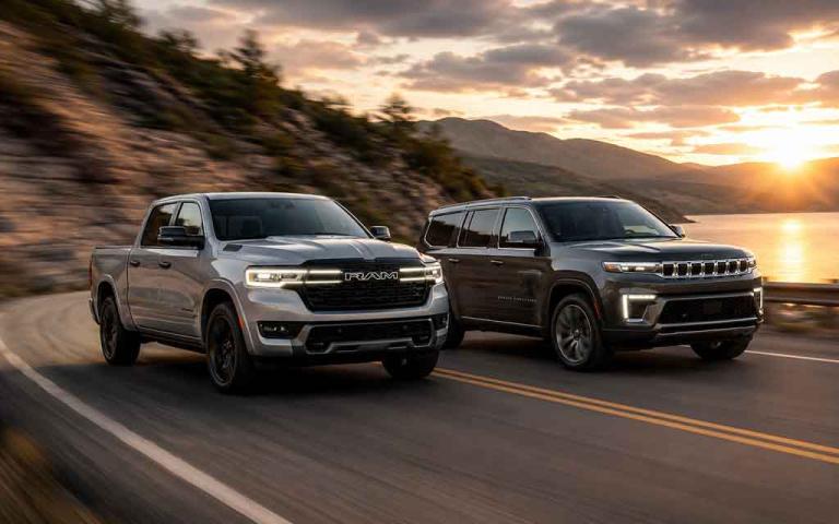 Ram 1500 REV electric pickup and Jeep Grand Wagoneer EREV SUV showcasing Stellantis' new extended-range electric vehicle technology.